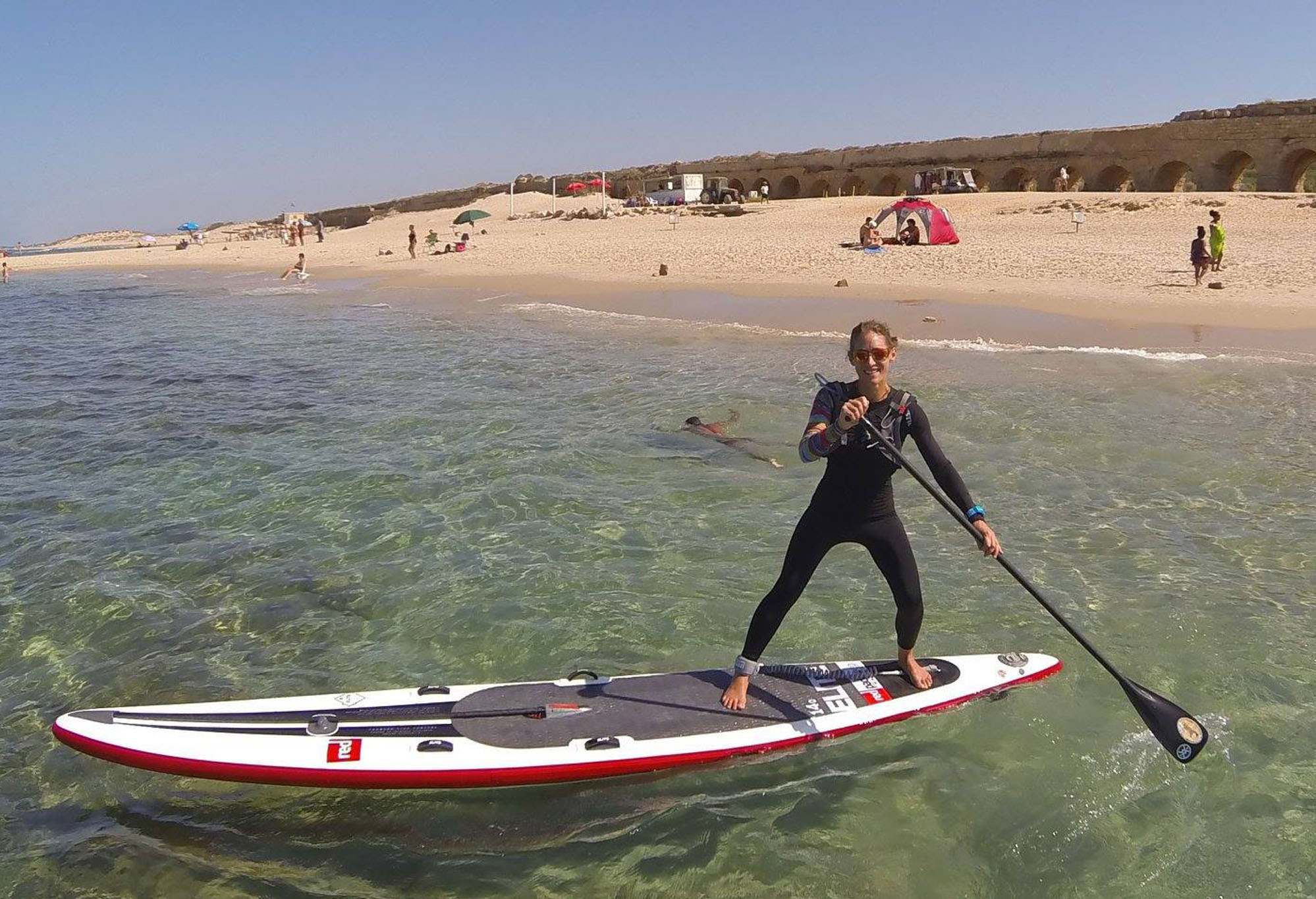 Paddle boarder on beach