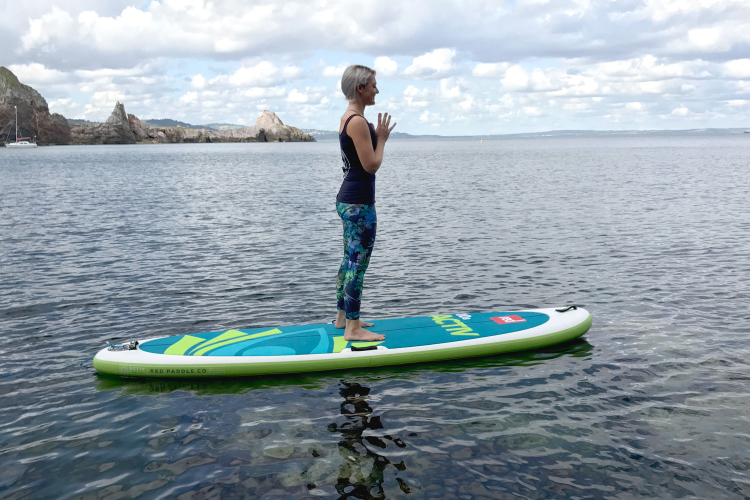 Standing yoga on paddle board