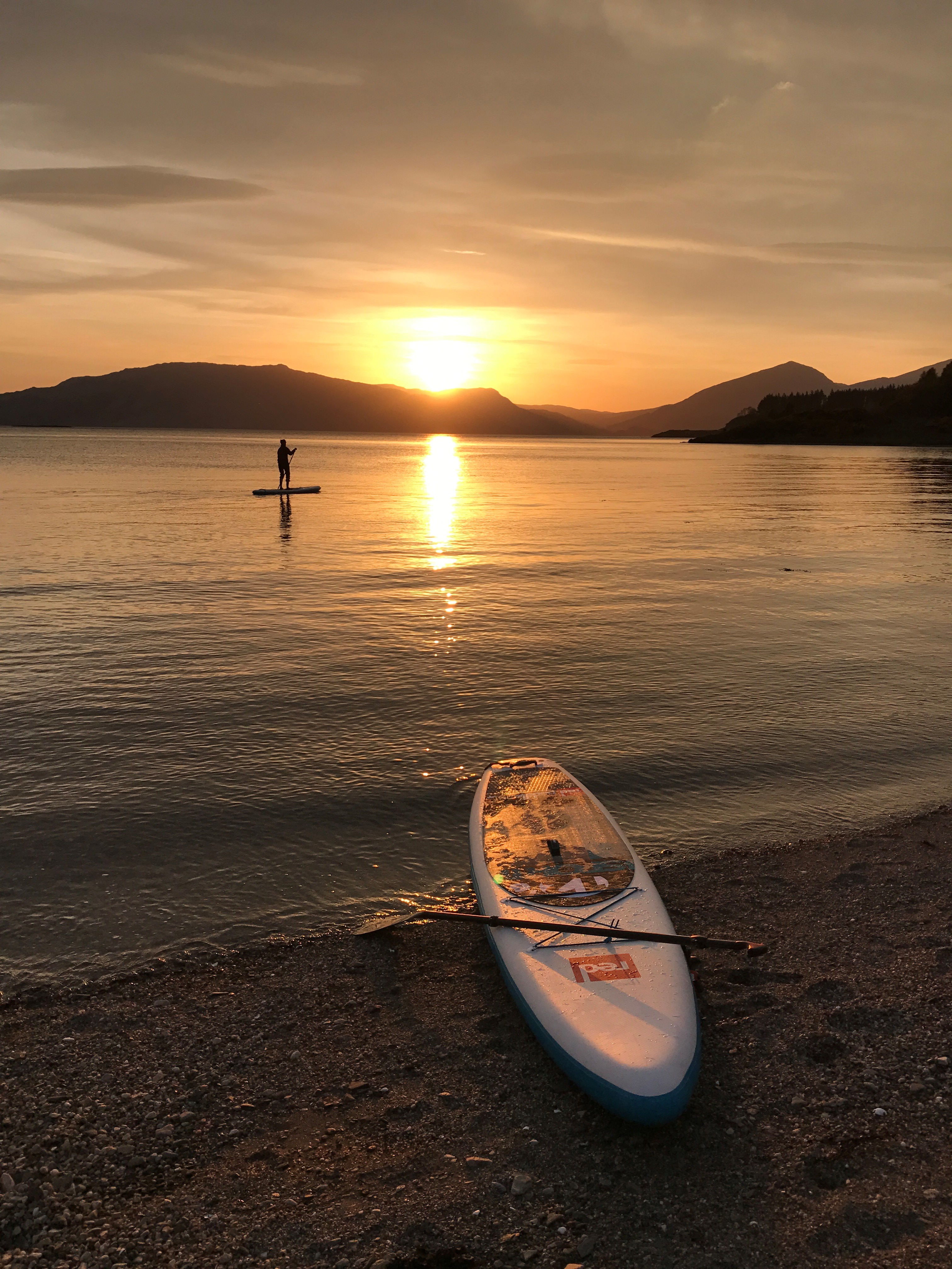 Sundown at Castle Stalker paddle boarding