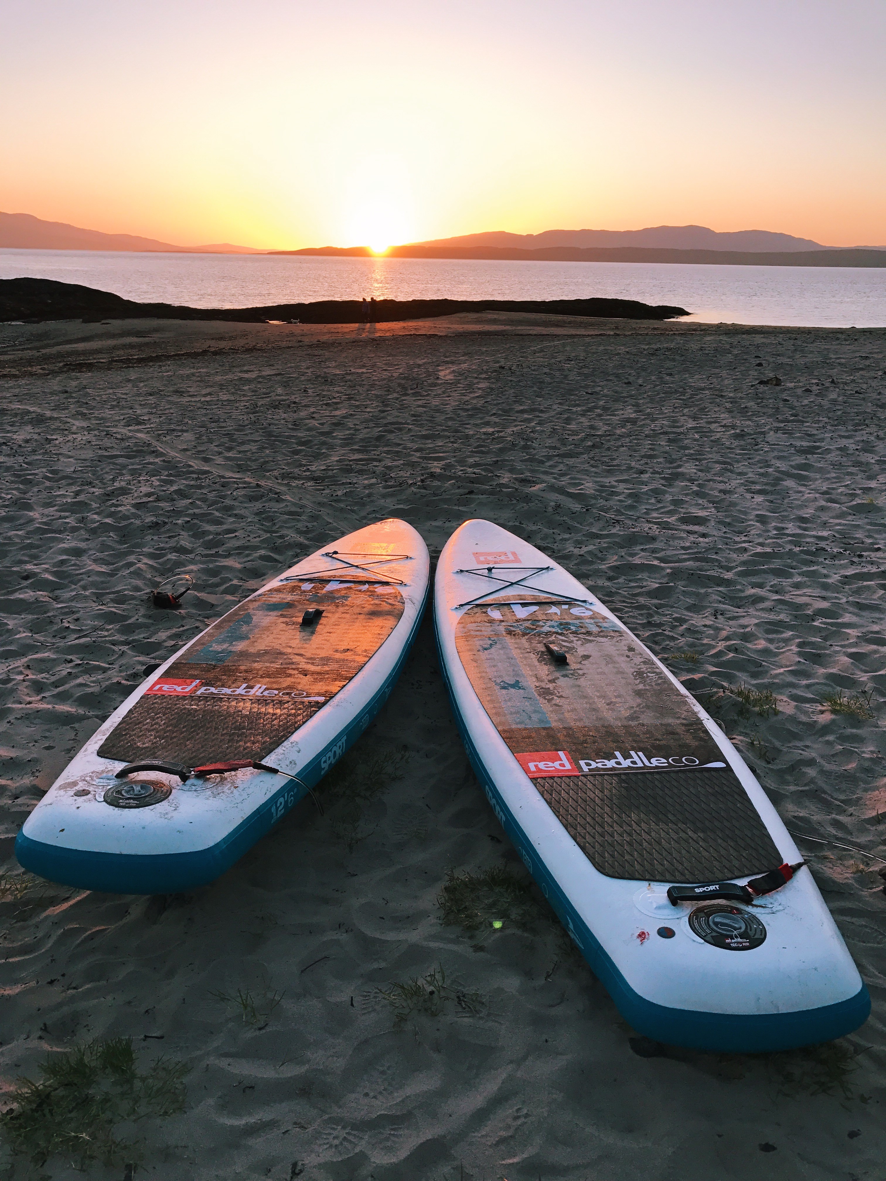 Red Paddle boards at sunset