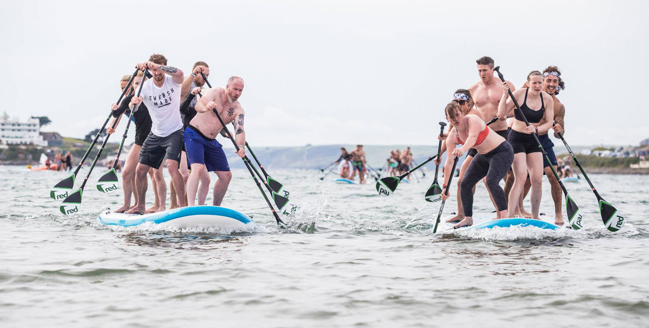 Paddle boarders racing