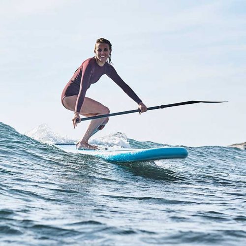 Woman surfing her Red Paddle Co 8'10" Whip