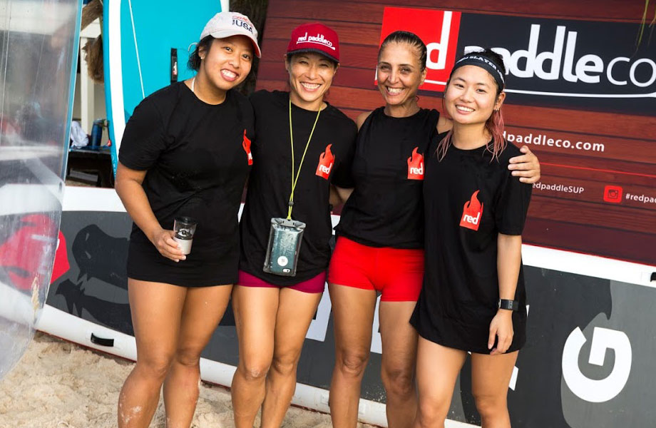 four girls in SUP racing team pose for picture