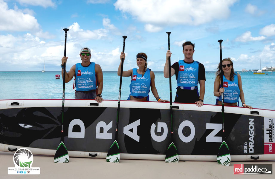 paddle board team pose with 22ft dragon board