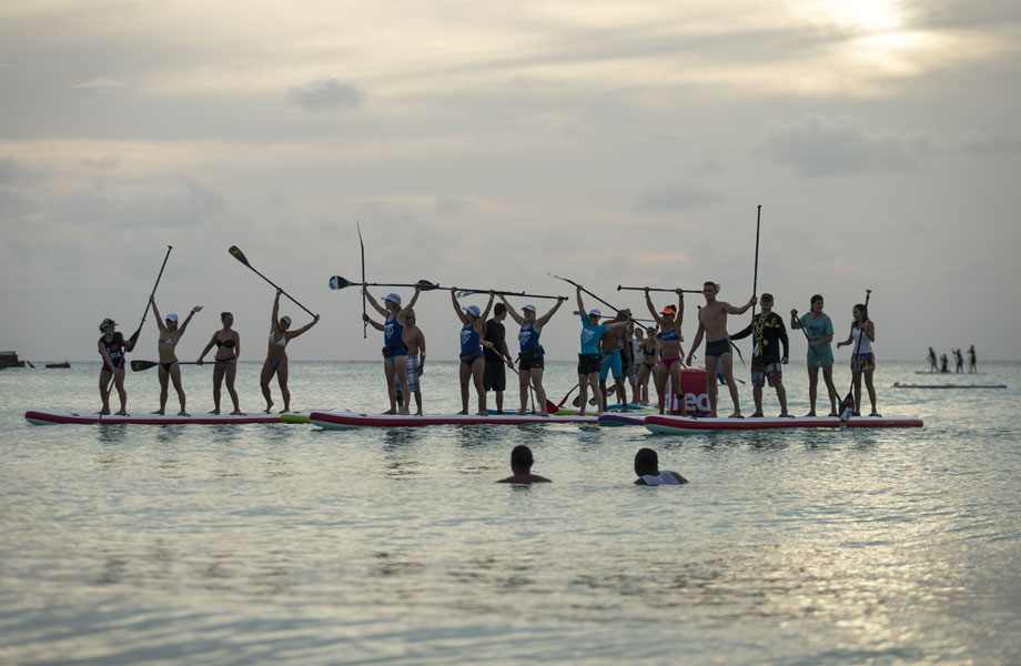 teams celebrate on dragon paddle boards