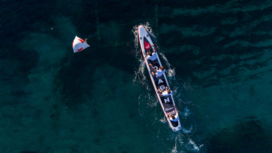 a team of four on the 22ft red dragon inflatable sup, training for the dragon world championships