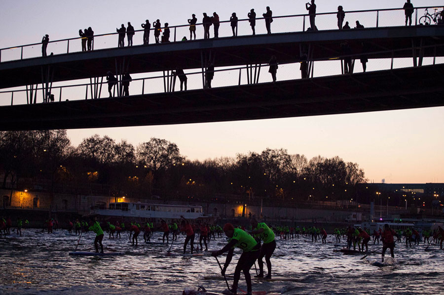 Silhouette of spectators watching Nautic SUP Open in Paris