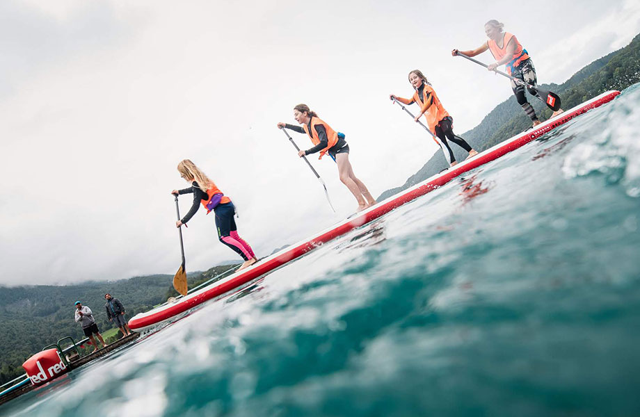 mother and three daughters paddle together on the Dragon paddle board
