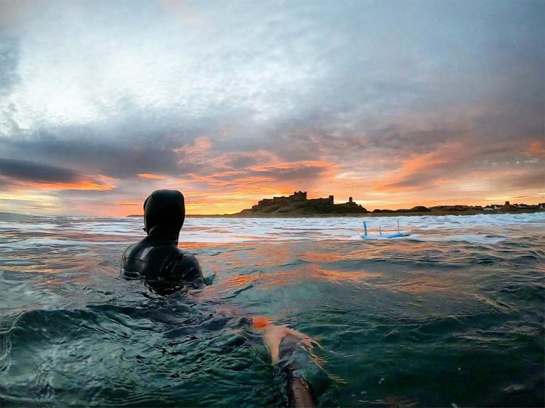 wild swimming at sunset